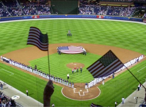 Photo courtesy of Getty Images   Fans wave flags at the New York Mets’ Shea Stadium Sept. 21, 2001.
