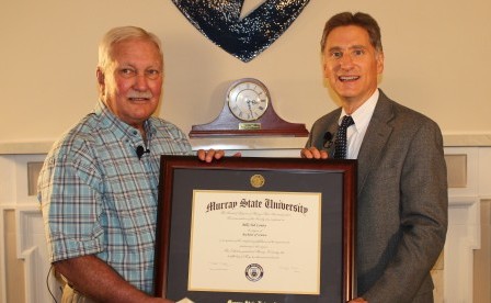 President Randy Dunn awards Bill Lowry his degree after 51 years. || Photo courtesy of Academic Affairs