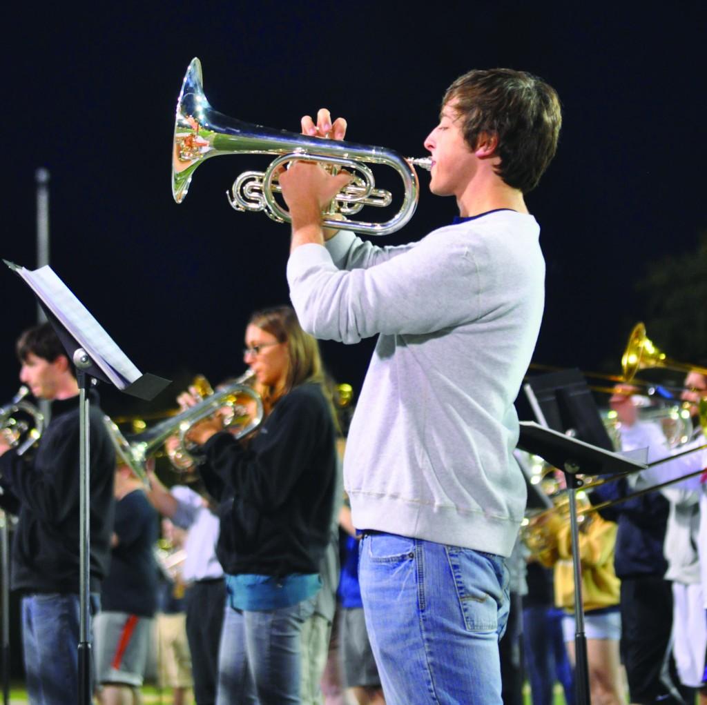 Craig Taylor, senior from Russellville, Ky., practices his mellophone during a Racer Band rehearsal earlier this week. The Racer Band has a record-breaking 310 members this season including 185 returning members. || Kylie Townsend/The News