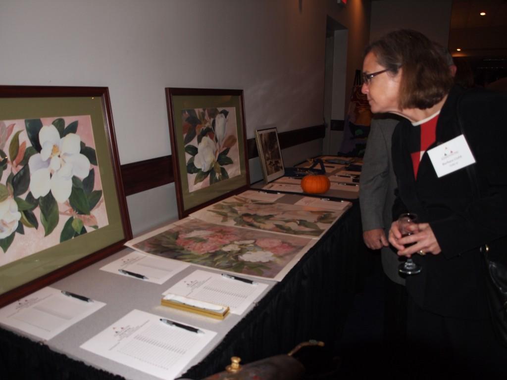 Community members, faculty and alumni attended the annual ‘A Taste of the Arts’ auction. They bid on art pieces and other items to support local arts programs. || Beamer Barron/The News