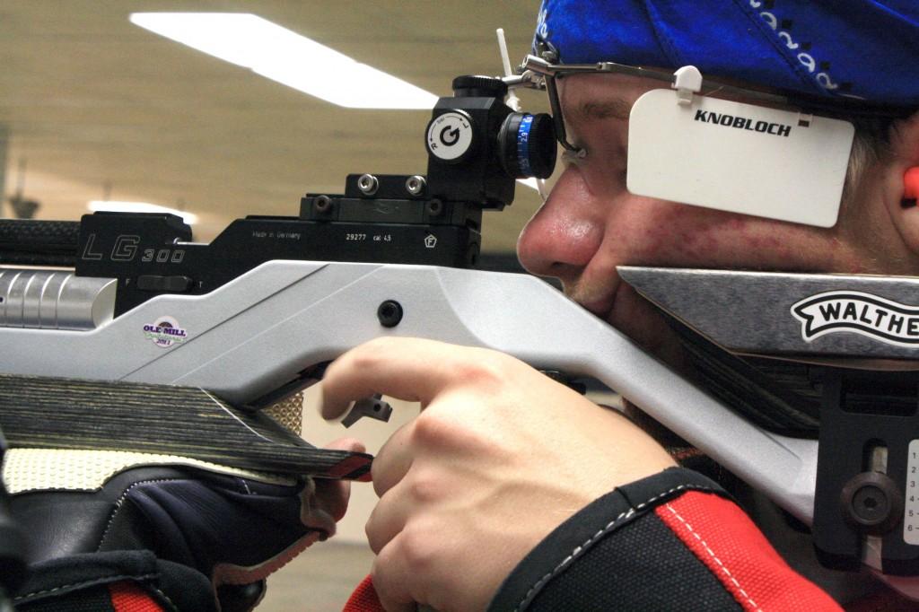 Freshman Ryan Limpus takes aim during a practice session. Limpus posted a career-best in air rifle Saturday. || Austin Ramsey/theNews