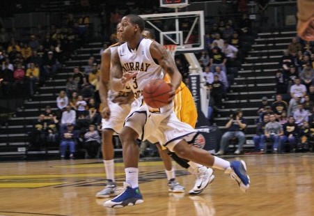 Senior guard Isaiah Cannan handles the ball around defenders in the first half of the Racers third season loss against Valparaiso.
