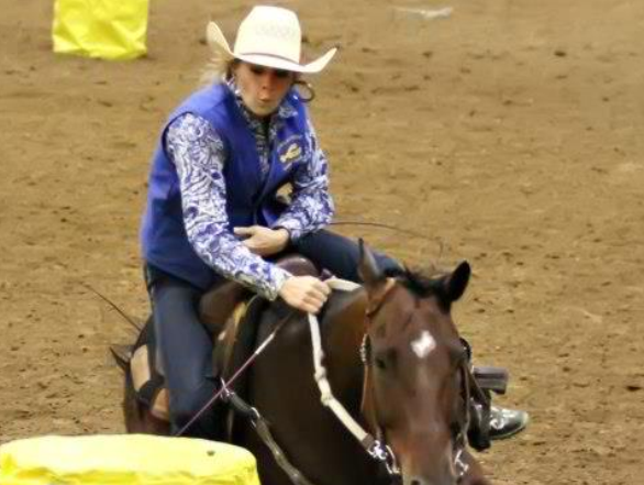 Taylor Smith, freshman from Benton, Ky., runs the barrels in the William ”Bill” Cherry Agricultural Expo Center at the Murray State Rodeo on Oct. 4-6. || Photo courtesy of Taylor Smith
