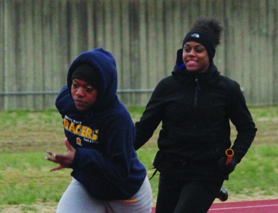 Junior Sharda Bettis and sophomore Natalie Pattin run at Wednesday’s practice. The relay team of Bettis, Pattin, senior Alexis Love and sophomore LaShea Shaw finished in fifth in the 4x400 meter relay at the event. || Taylor McStoots/The News