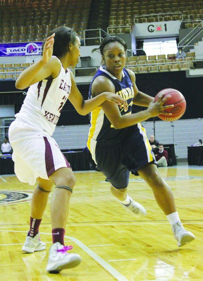 Senior Kyra Watson dribble past an Eastern Kentucky defender at the OVC Tournament game Wednesday night. Though the team started out the first half strong, they could not hold back EKU’s strong defense. || Taylor McStoots/The News