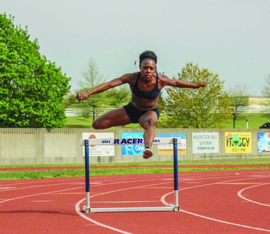 Junior+sprinter+Sharda+Bettis+leaps+over+a+hurdle+during+practice.+Kate+Russell+%7C%7C+The+News