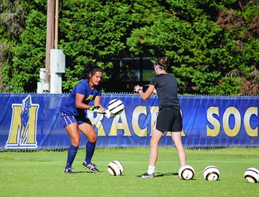 Taylor McStoots/The News
Freshman Kylie Lawrence (left) works on her goalkeeping in a practice earlier this week.