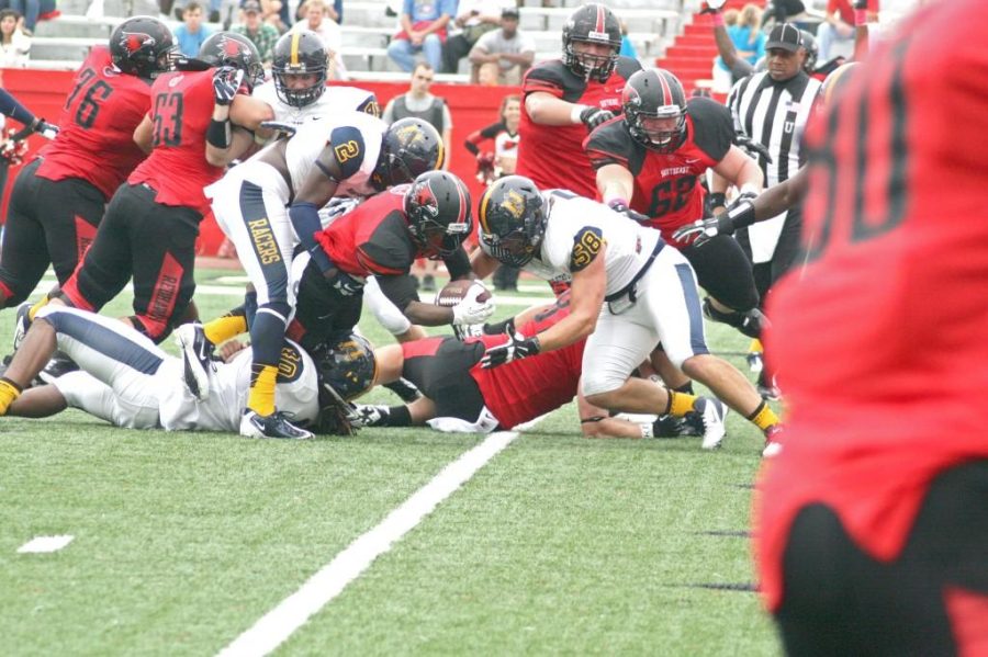 Ryan%3FRichardson%2FThe+News%0ASeveral+Racers+attempt+to+stop+the+Redhawks+from+scoring+one+of+their+five+touchdowns+Saturday+in+the+loss+to+SEMO.