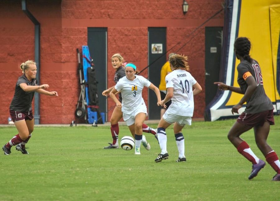 File photo
Junior midfielder (3) Julie Mooney carries the ball upfield as junior defender Bronagh Kerens (10) stands open for a pass during a game against University of Arkansas at Little Rock this season.
