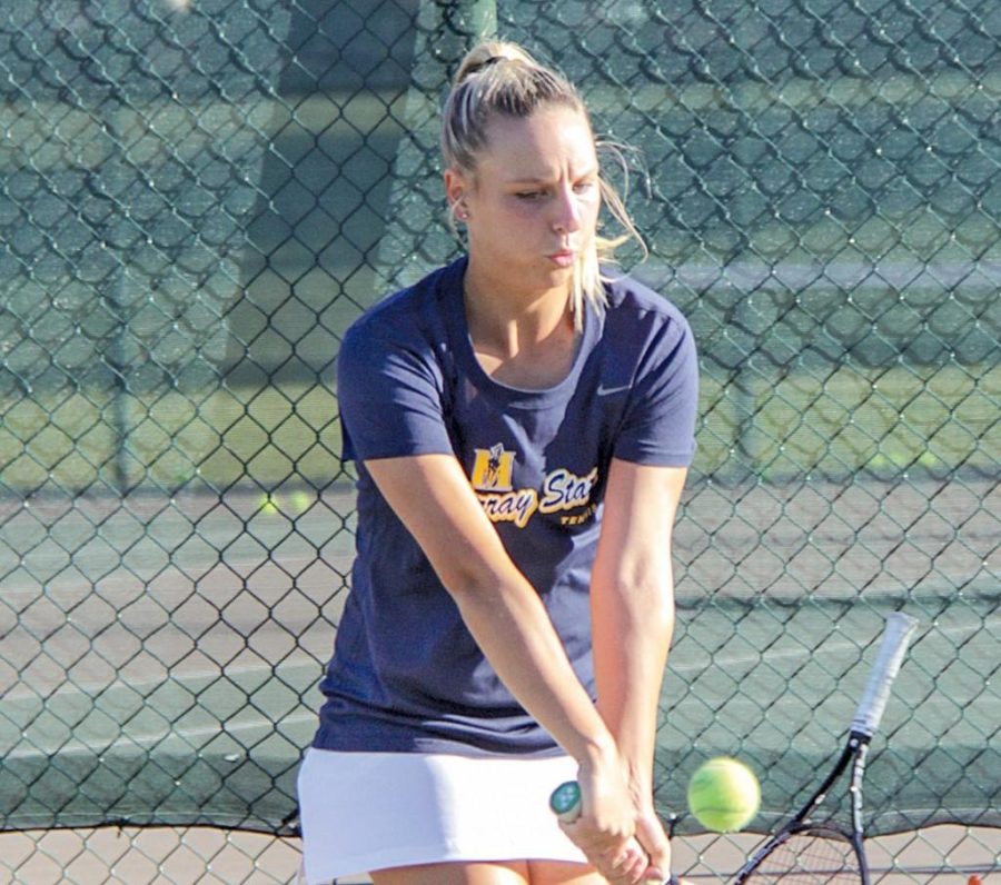 Carla Suga (below) teamed with sophomore Megan Blue to claim second place in doubles play.