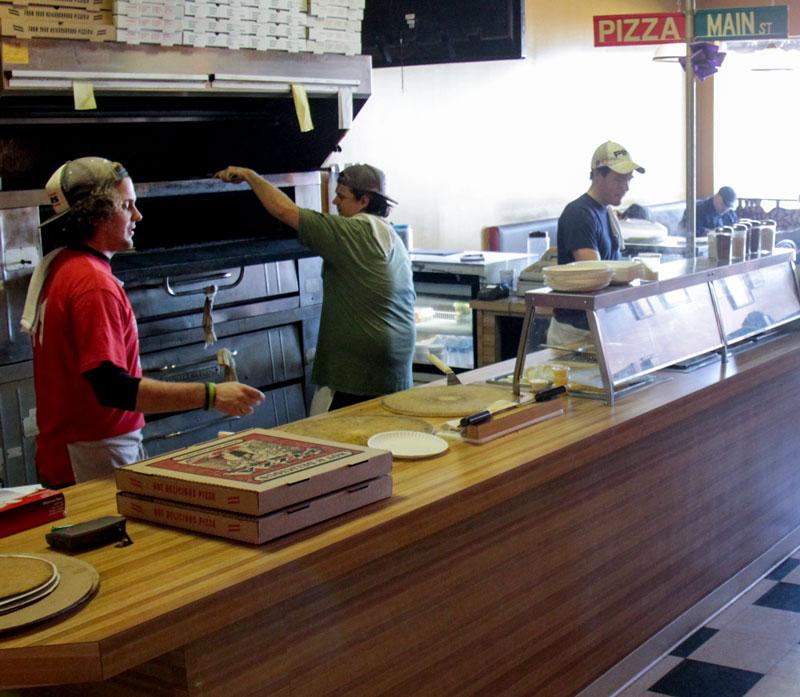 Lori Allen/The News
Matt B’s workers prepare pizza in their newly renovated restaurant on Main Street.