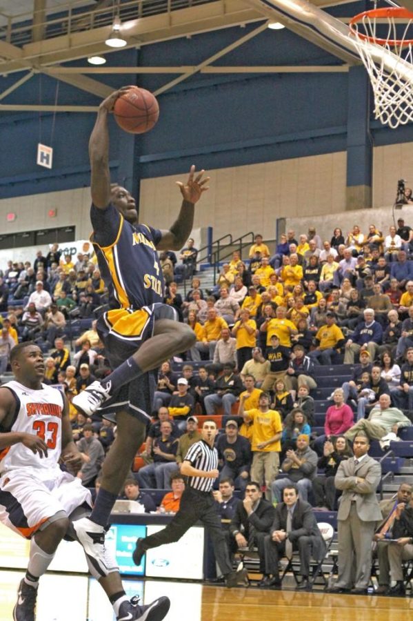 Senior forward Jarvis Williams rises up for a dunk in the Racers’ win over UT?Martin Thursday night. || Photo by Kate Russell/The News