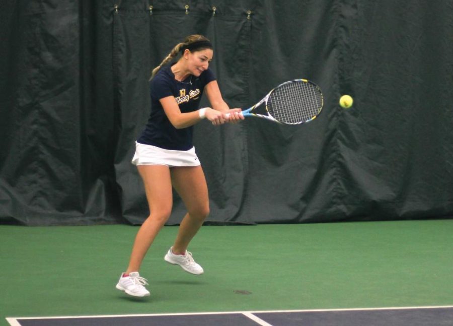 Jenny Rohl/The News
Senior Carla Suga hits a shot in her three-set win against an Arkansas State opponent Saturday.