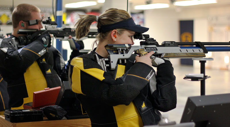 Kate Russell/The News
Sophomore Tessa Howald and senior Mike Burzynski practice shooting in the Pat Spurgin Rifle Range earlier this week.