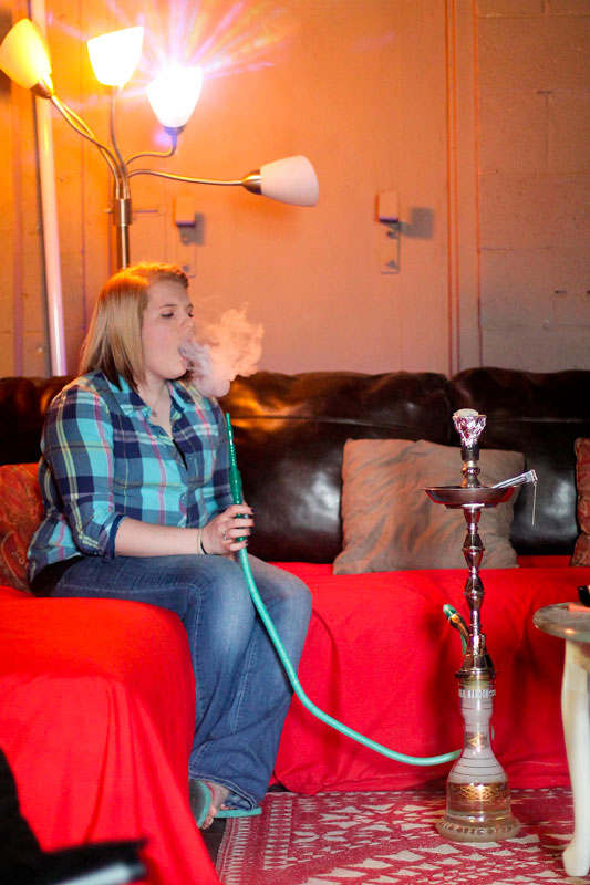 Jenny Rohl/The News
Elisha Cherry, employee of The Breakaway Lounge, smokes hookah. 