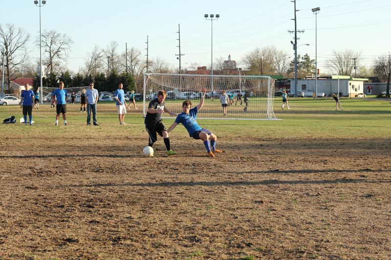 Kate Russell/The News
Sig Ep’s Robert Spalding dribbles past Sigma Chi’s Cody Waggoner.