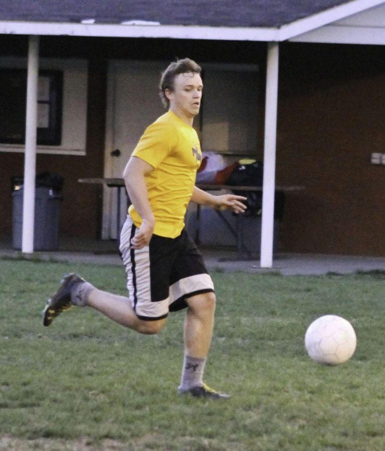 Jenny Rohl/The News
Sophomore Caleb Newcomer dribbles downfield against Korea A Tuesday on intramural field No. 2.