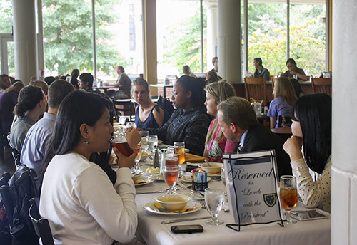 Photo courtesy of Dining Services
President Bob Davies and students sit at a reserved table in Winslow Dining Hall for Lunch with the President.