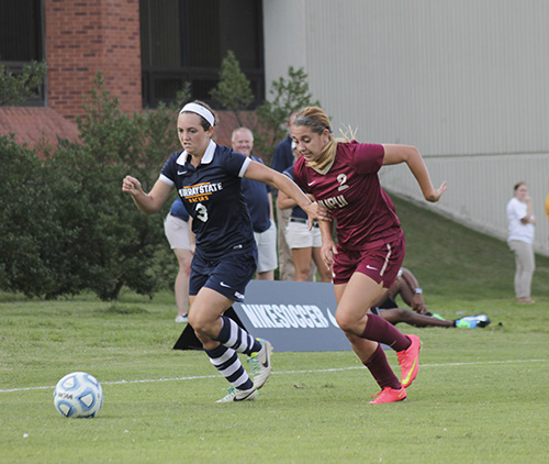Jenny Rohl/The News
Senior forward Julie Mooney dribbles past an IUPUI defender Sept. 19 at Cutchin Field.