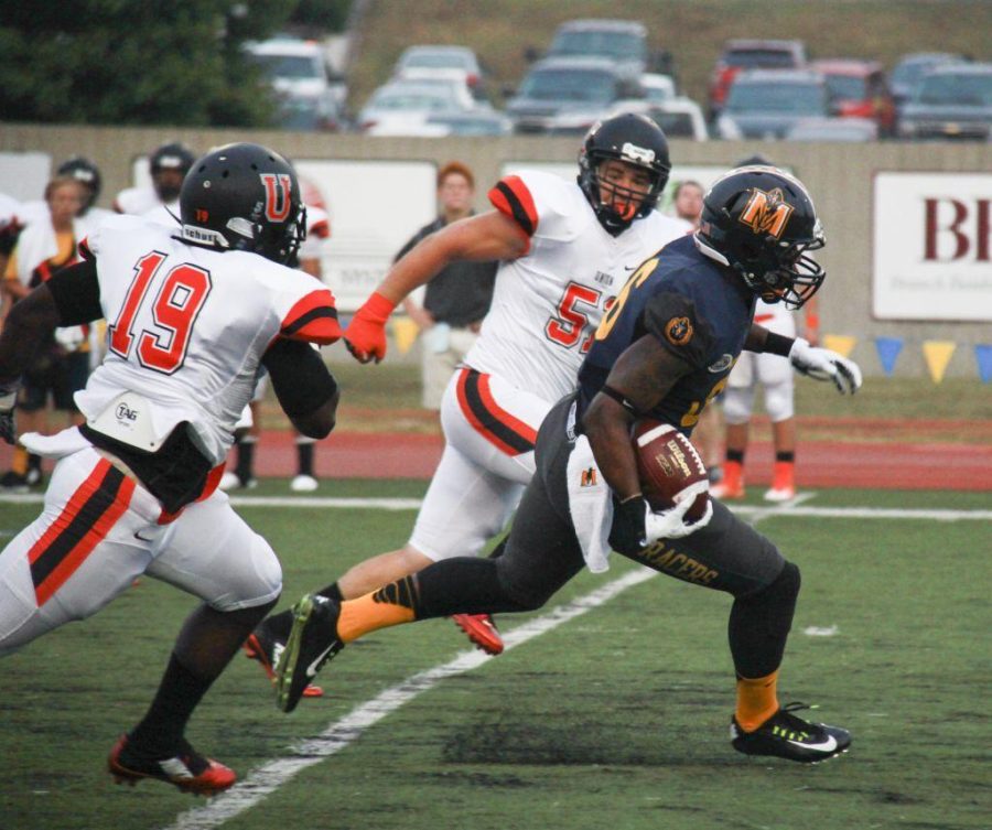 Fumi Nakamura/The News
Sophomore Marcus Holliday carries the ball in the season opener against Union College, where Murray State won 73-26.