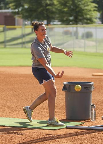 Haley Hays/The News
Head Coach Kara Amundson pitches to her team at practice earlier this season.