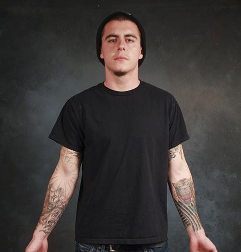 Photo illustration by Fumi Nakamura
Kade Cullop dresses in casual attire and business attire to represent the stigma still associated with tattoos in the workplace.