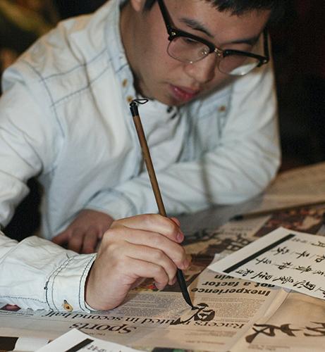 Haley Hays/The News
Chinese international student, Xiankun Xu, showcases his calligraphy at a workshop Monday.