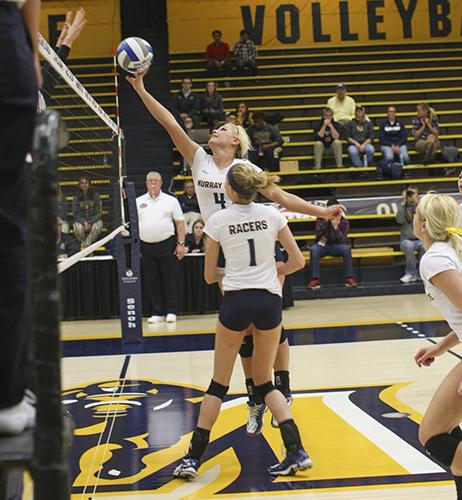 Haley Hays/The News
Junior setter Sam Bedard pushes the ball over the net during their opening Championship game Thursday night.