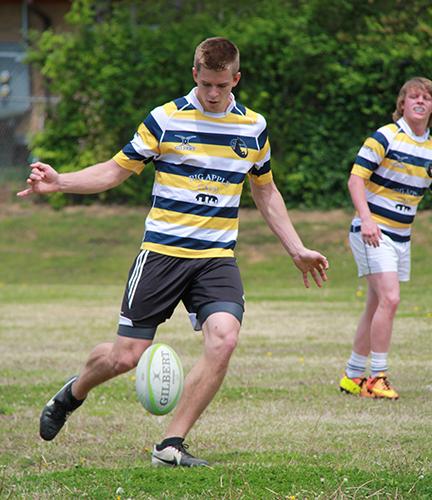 Fumi Nakamura/The News
Rugby player Travis Nelson competes against alumni last season.