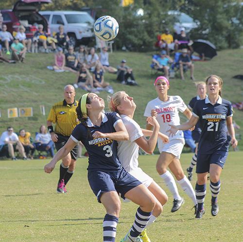 Jenny Rohl/The News
Senior Julie Mooney battles a Belmont Bruin for a header during the Oct. 26 game at Cutchin Field.