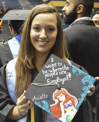 Hannah Fowl/The News
Arielle Lyford, graduate from Elizabethtown, Ky., holds her decorated Ariel cap from December’s graduation.