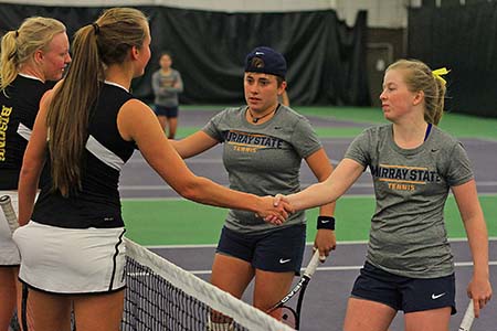 Photo courtesy of Racer Athletics 
Doubles players, senior Andrea Eskauriatza and junior Erin Patton, shake the hands of the Lipscomb University Bisons after their match.