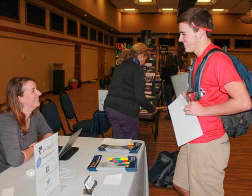 Jenny Rohl/The News
Sophomore Sawyer Rambo visits the Regional Outreach table at the Real World Market.