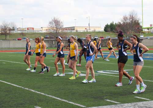 Nicole Ely/The News
Women’s track and field prepare to accept their awards at their home meet April, 4.