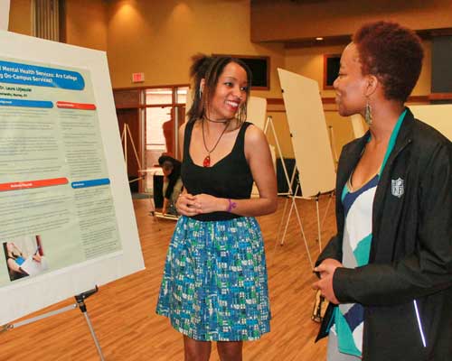 Jenny Rohl/The News
Egypt Crider, senior from Metropolis, Ill., presents the results of her research to Chesika Crump, senior from Hopkinsville, Ky.