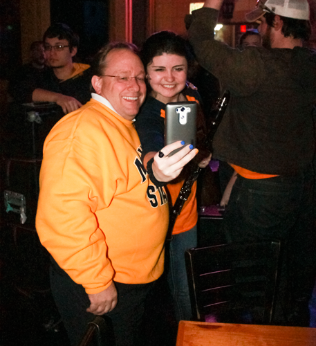 Jenny Rohl/The News
President Bob Davies takes a selfie with a member of the Racer Pep Band at Tequila Cowboy before the men’s basketball OVC Championship.