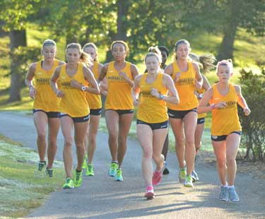 Chalice Keith/The News
Led by senior Emma Gilmore from Locks Heath, England, the women’s cross country team runs on Miller Memorial Golf Course to practice for their 2015 season.