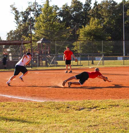 Nicole Ely/The News
A member of the Alpha Sigma Phi team dives to save the ball and strike out a member of the Sigma Chi team.
