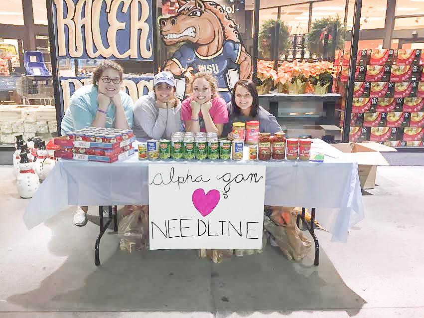 Alpha Gamma Delta members collect food goods at Kroger. Photo contributed by Emily Cook.