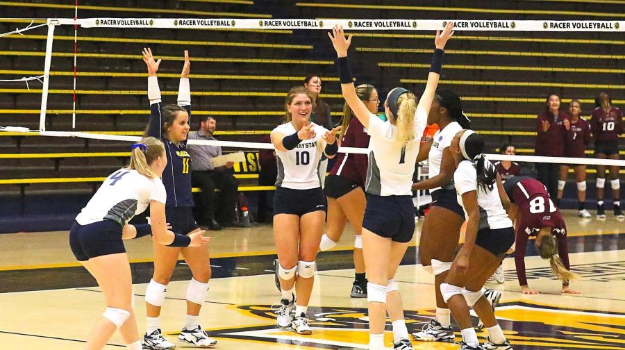 Racers+celebrate+after+winning+the+point.+%28Photo+by+Dave+Winder%2FRacer+Athletics%29