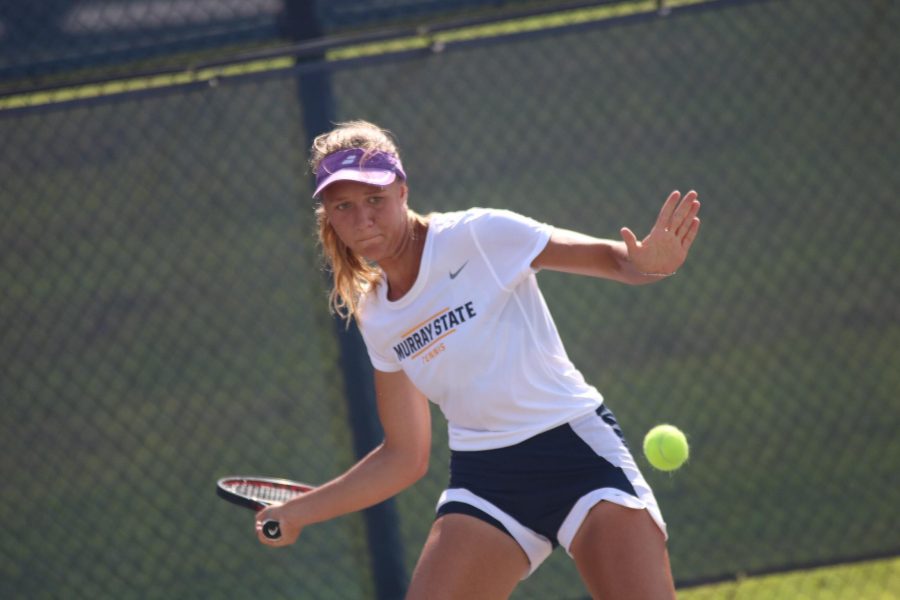 Sophomore Stasya Sharapova winds up to hit the ball during her singles match. (Blake Sandlin/TheNews)