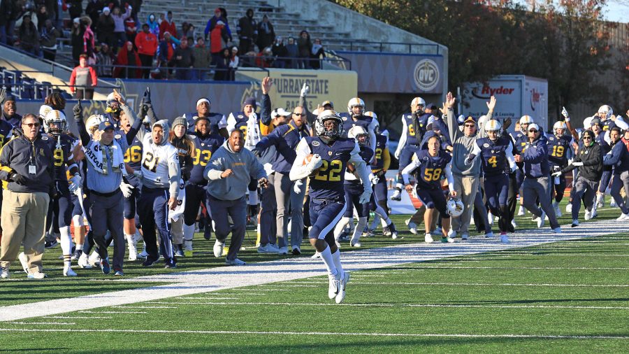 Malik Honeycutt takes it to the house to claim a 40-38 victory over the Redhawks. (Photo by Dave Winder/Racer Athletics)