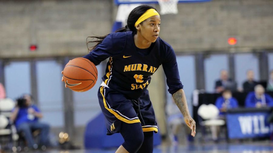 Janika Griffith-Wallace drives down the court against the Wildcats. (Photo courtesy of Willard Jones/Racer Athletics)