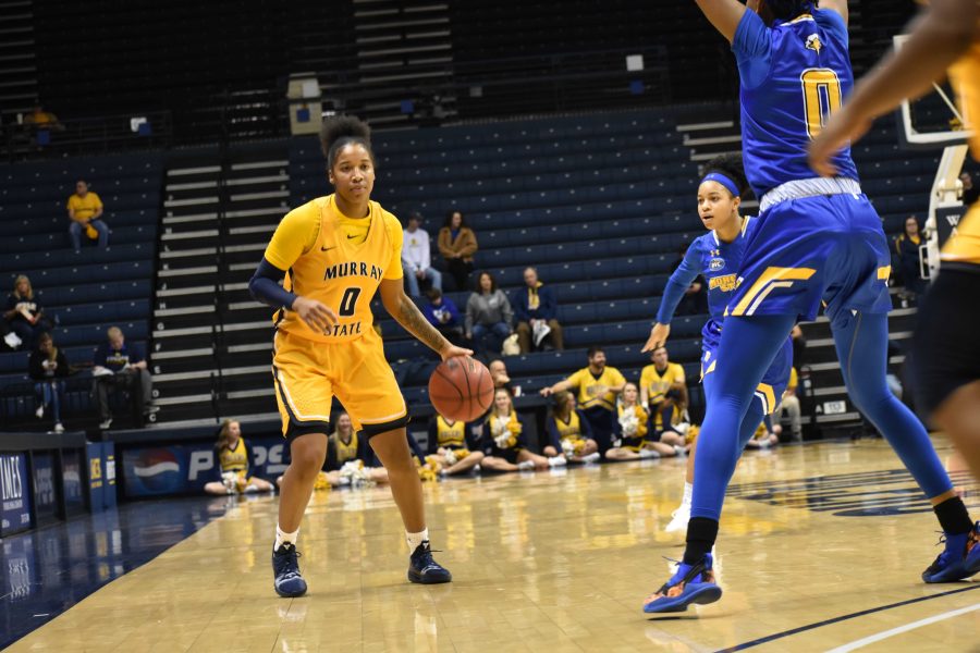 Janika+Griffith-Wallace+prepares+to+pass+the+ball+to+the+corner.+%28Photo+by+Gage+Johnson%2FTheNews.%29