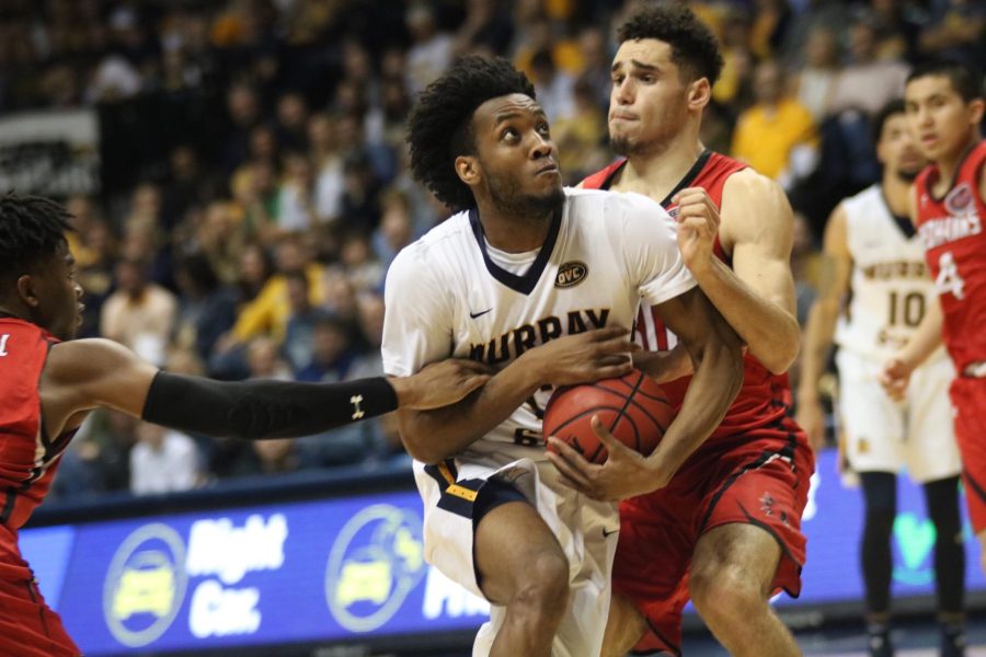 Sophomore forward Devin Gilmore drives to the basket against SEMO. (Photo by Blake Sandlin/TheNews)