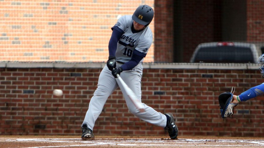 Junior first baseman Ryan Perkins swings at a pitch against the University of Memphis. (Photo courtesy of Curt Hart.)