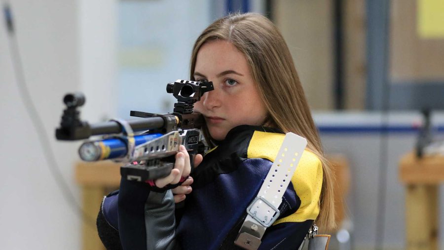 Freshman Anna Scheer prepares to fire her rifle. (Photo by Racer Athletics)