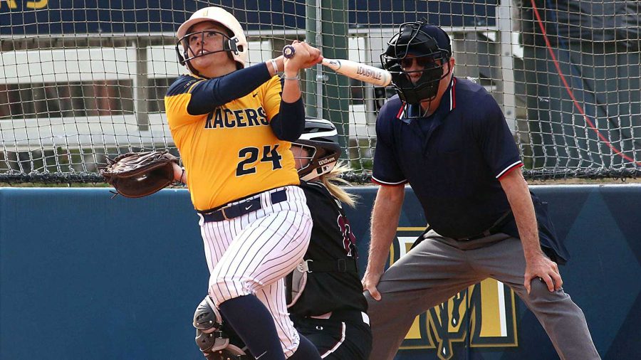 Senior catcher Madison Culver watches the ball after making contact. (Photo by Dave Winder/Racer Athletics)