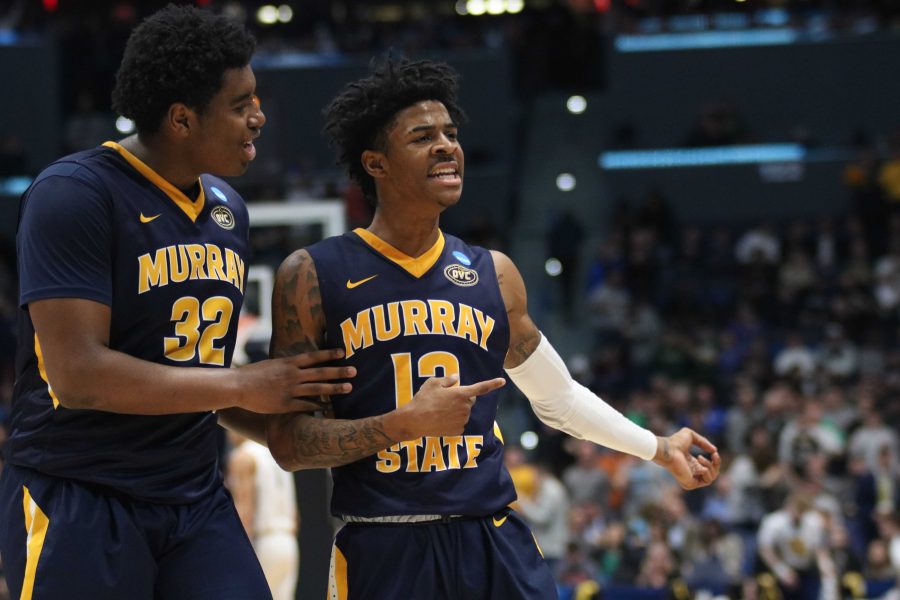 Sophomore guard Ja Morant and junior forward Darnell Cowart celebrate Morants last-second three in the first half. (Gage Johnson/TheNews)