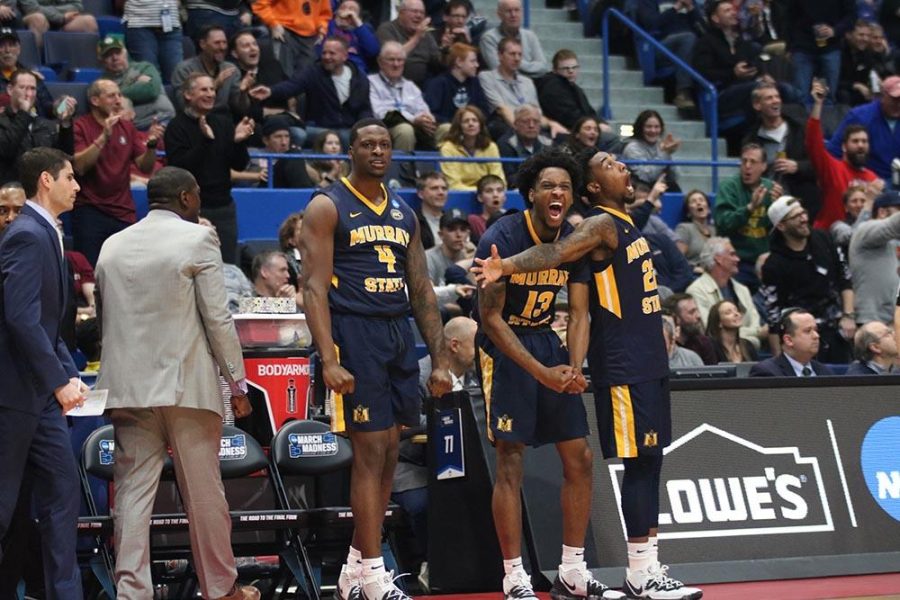Senior forward Brion Sanchious celebrates with sophomore forward Devin Gilmore and sophomore guard Brion Whitley during the Racers game against Marquette. (Gage Johnson/TheNews)